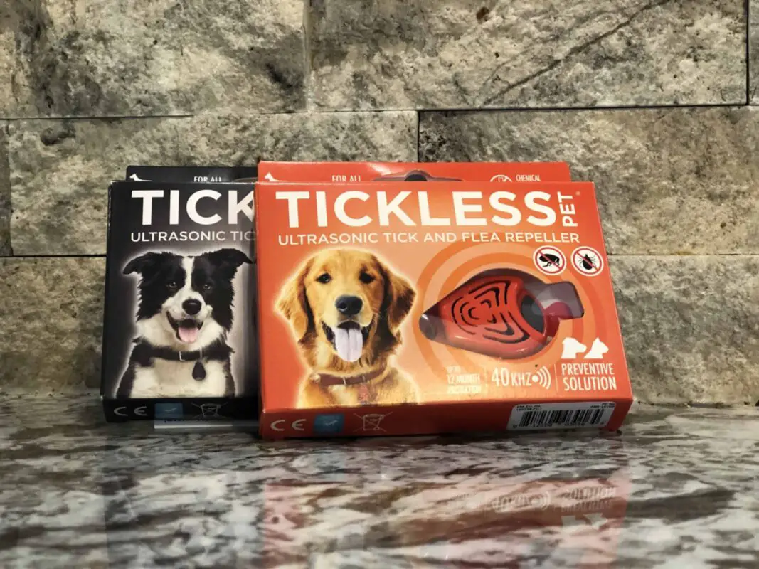 2 boxes of Tickless ultrasonic tick and flea repeller. 1 box is black the other is orange